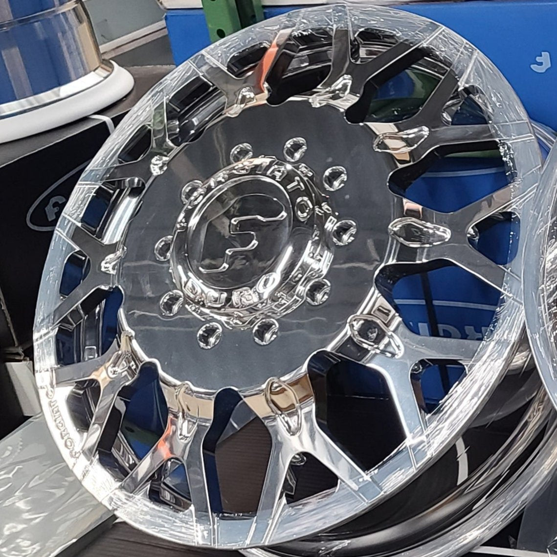A single green leaf against a white background.