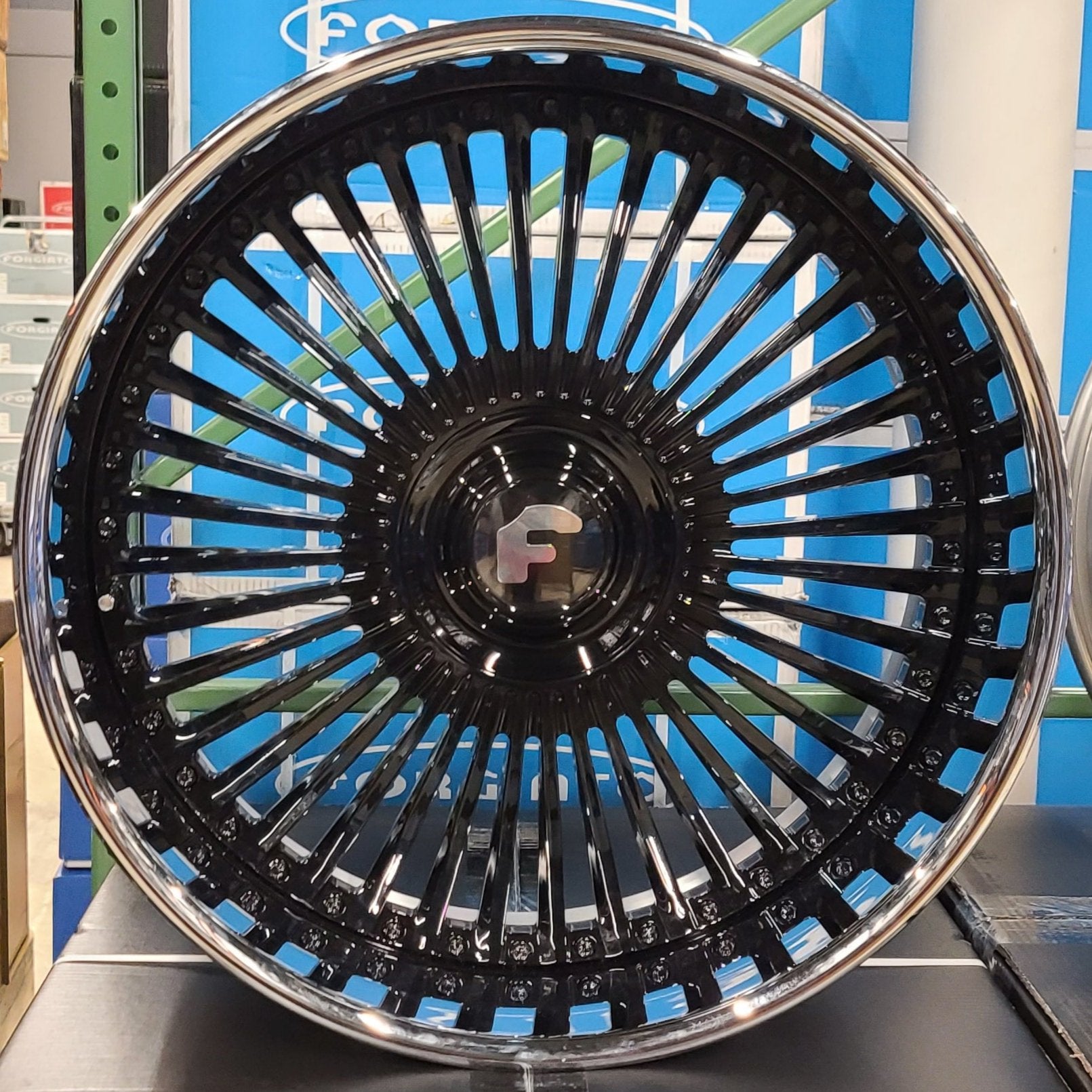 A single green leaf against a white background.