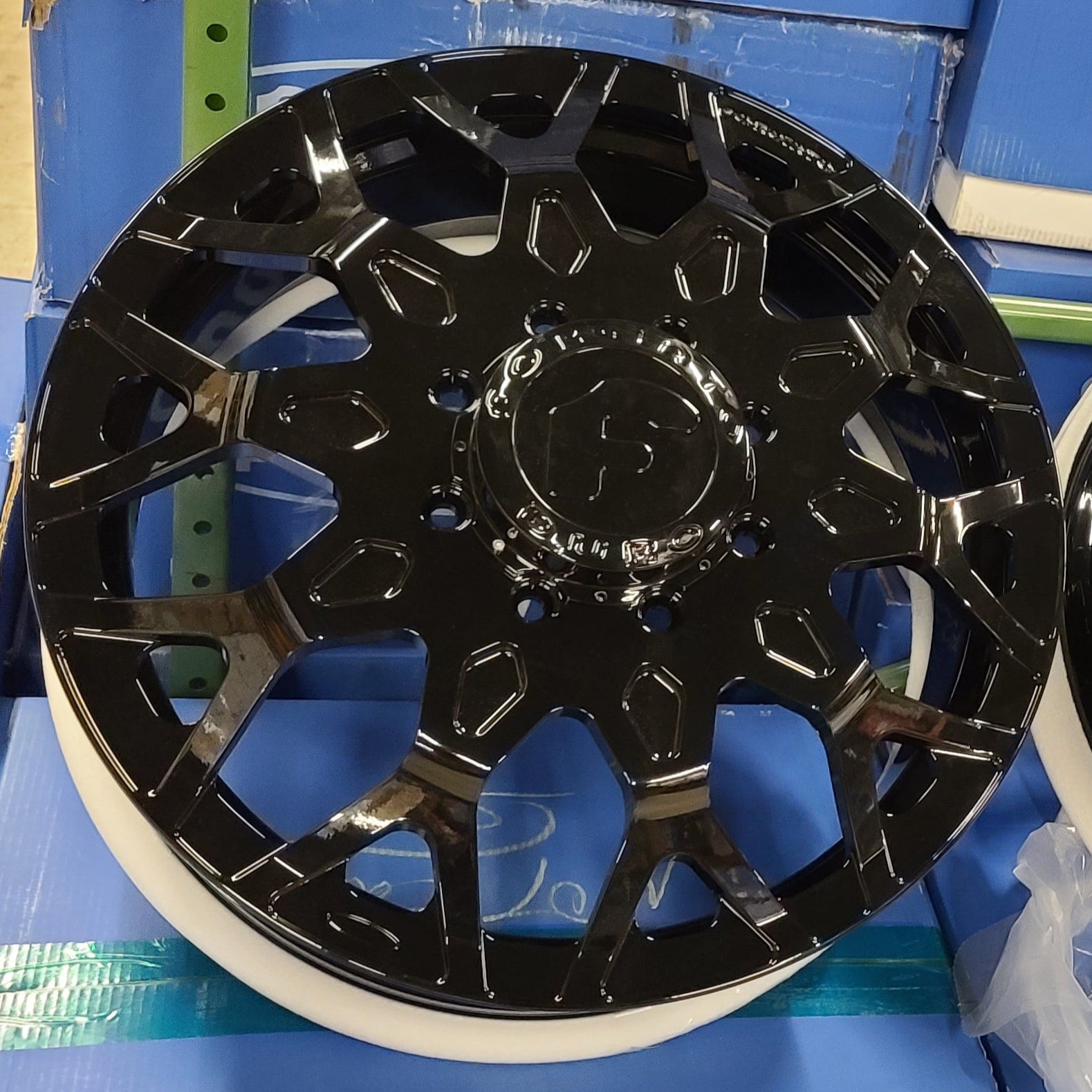 A single green leaf against a white background.