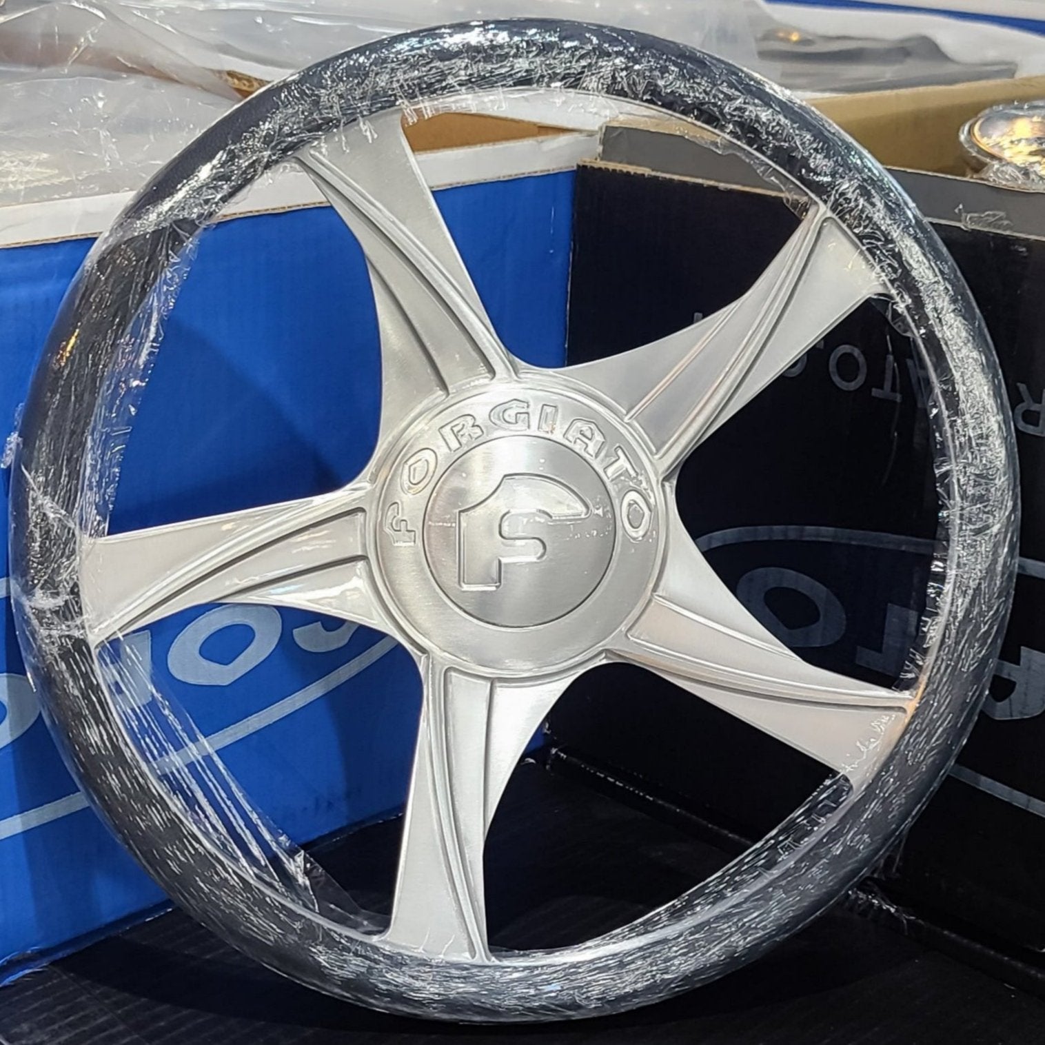 A single green leaf against a white background.