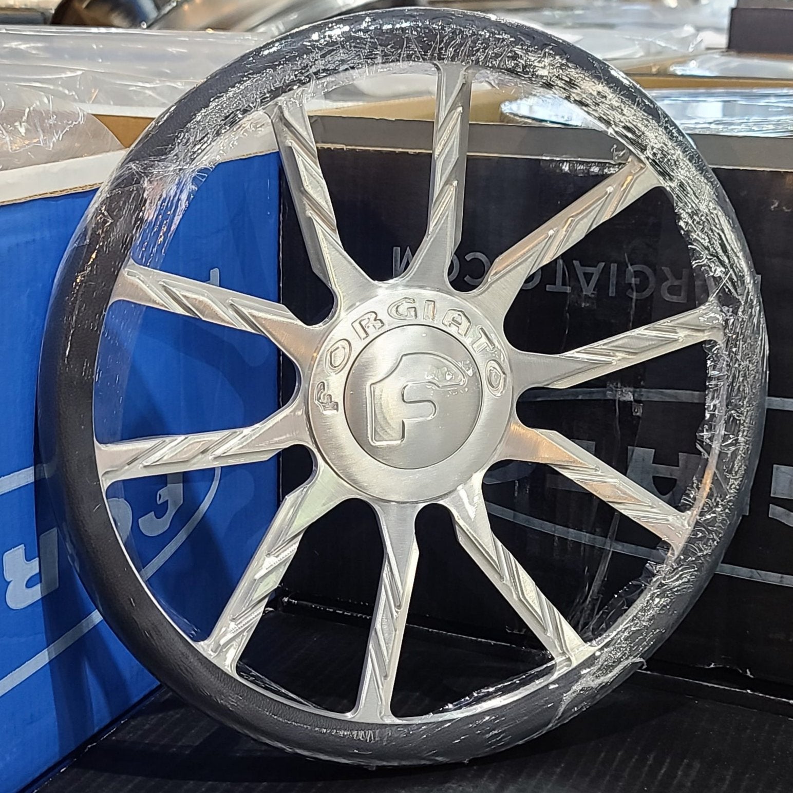 A single green leaf against a white background.