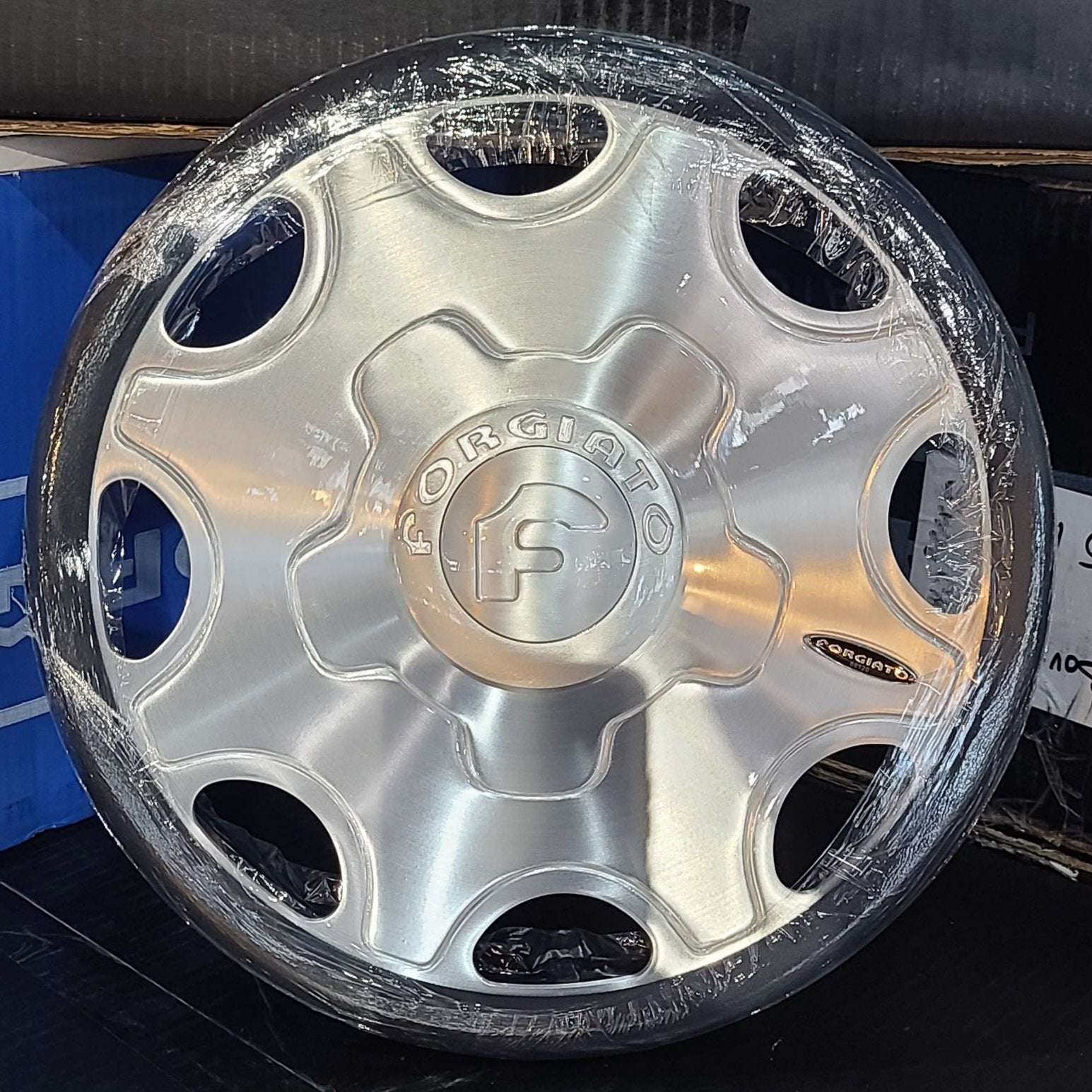 A single green leaf against a white background.