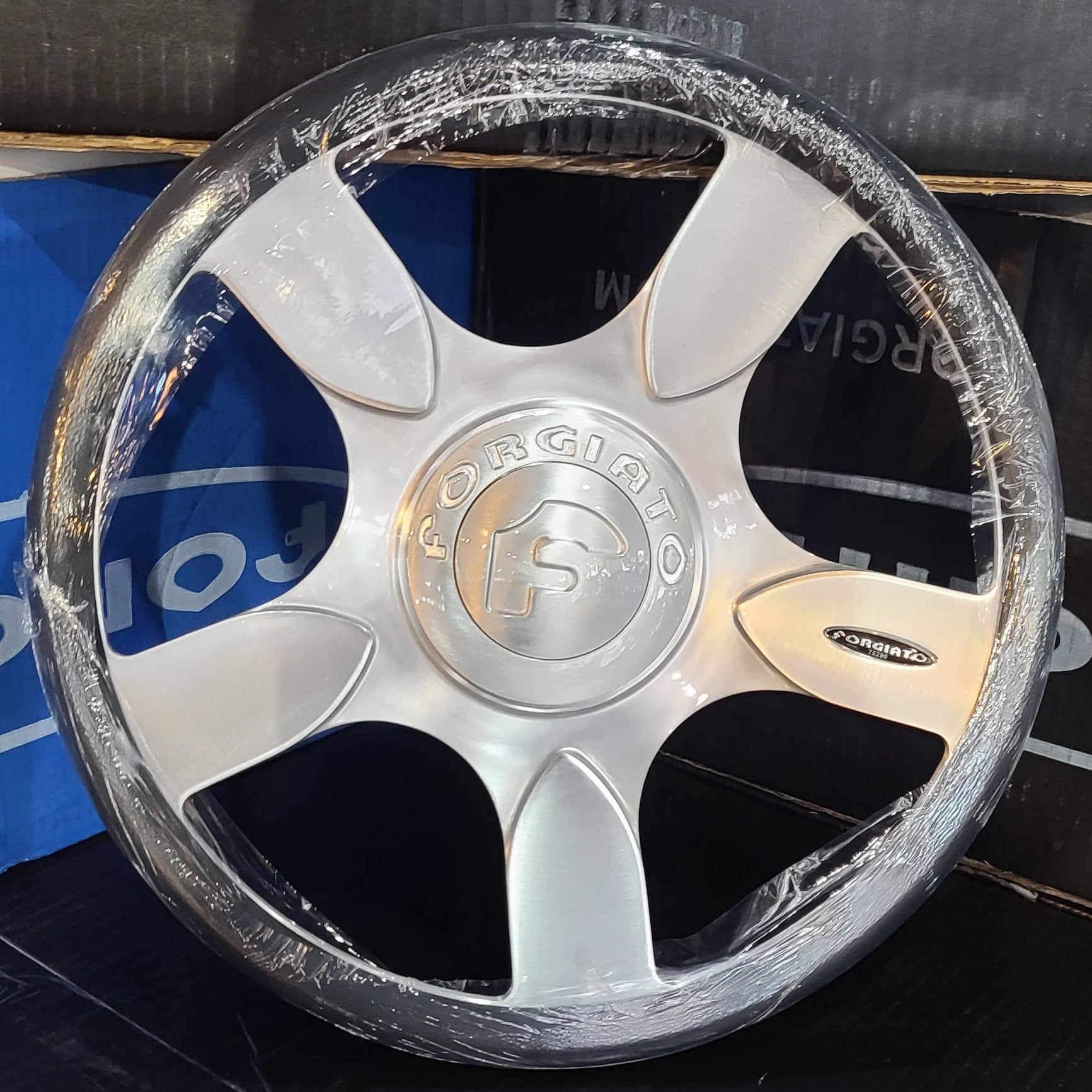 A single green leaf against a white background.