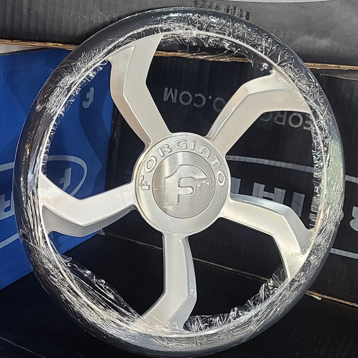 A single green leaf against a white background.