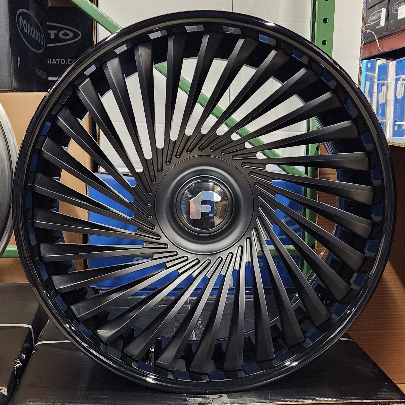 A single green leaf against a white background.