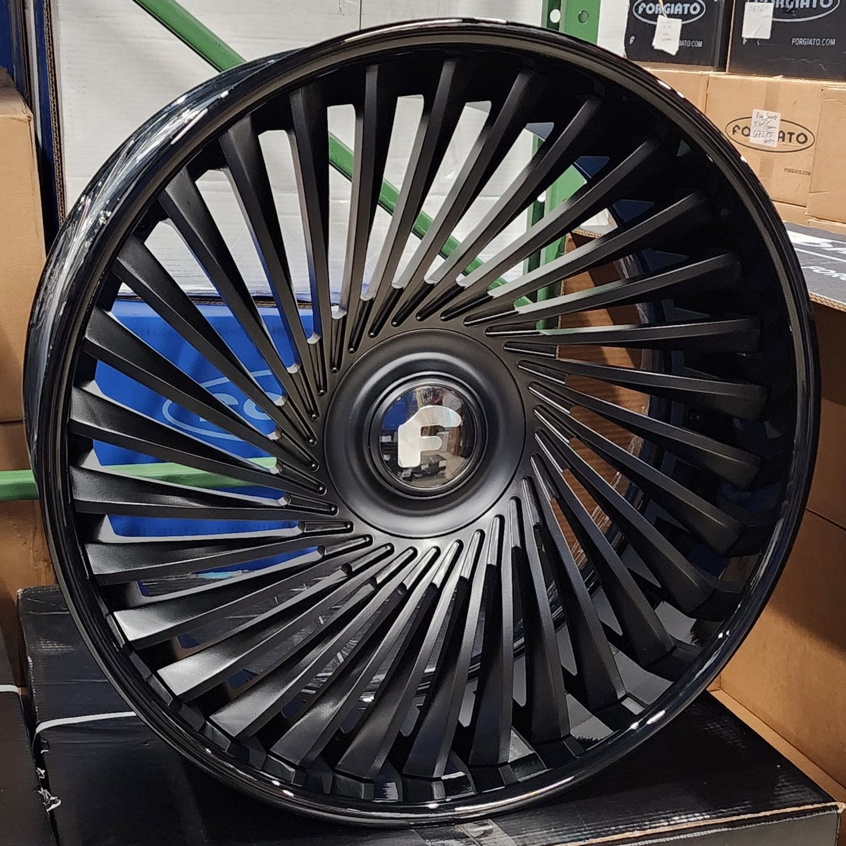 A single green leaf against a white background.
