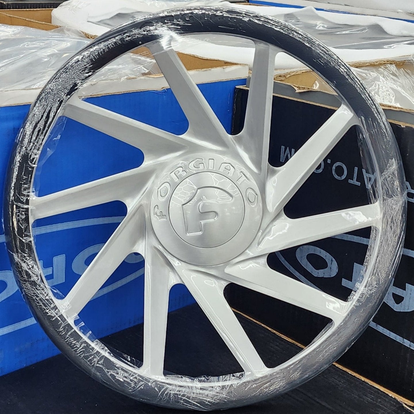 A single green leaf against a white background.