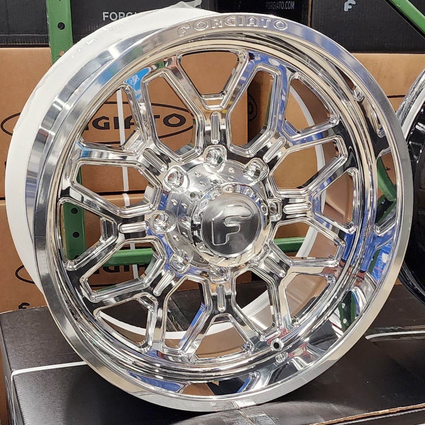 A single green leaf against a white background.