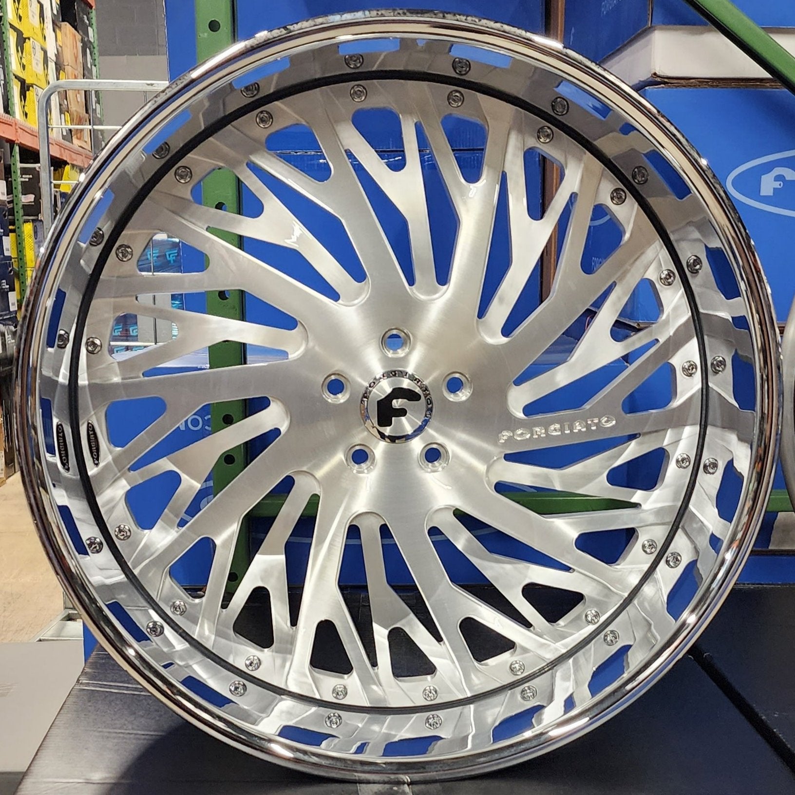 A single green leaf against a white background.