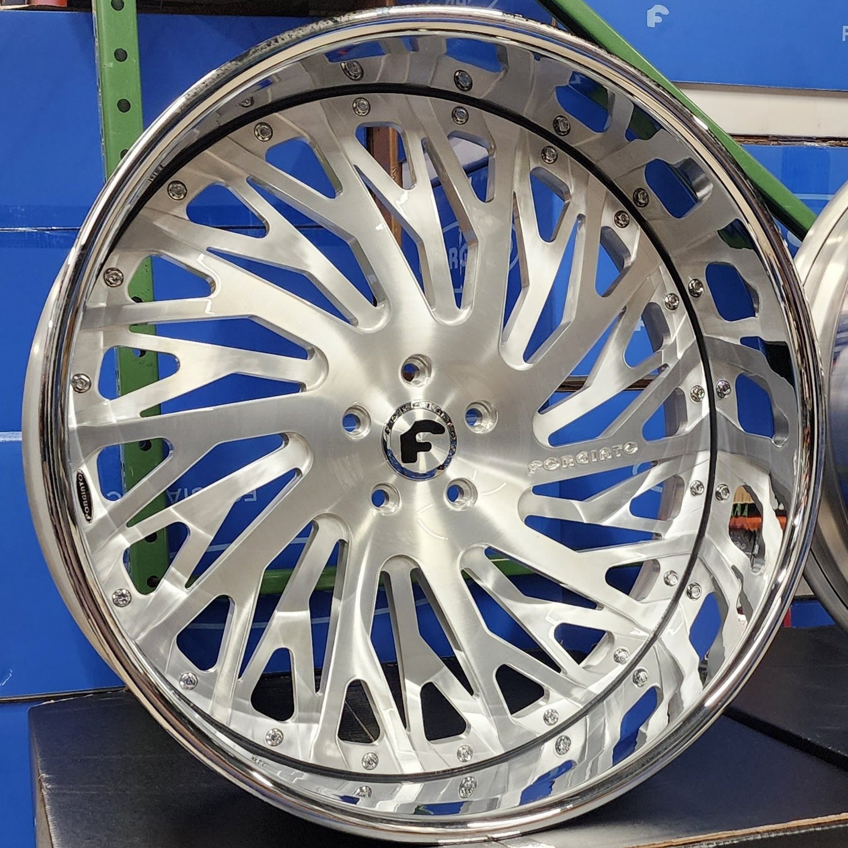 A single green leaf against a white background.