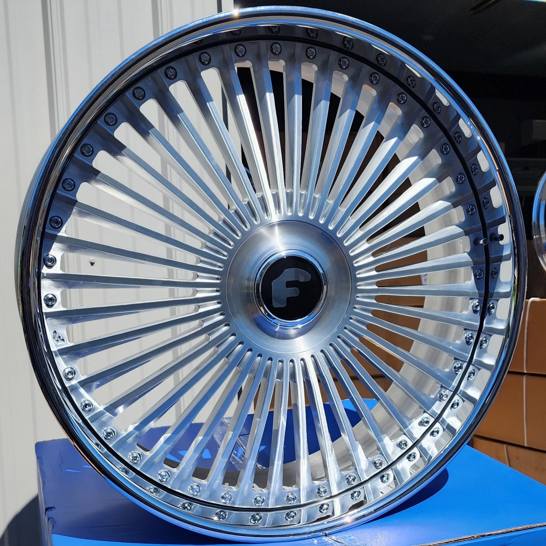 A single green leaf against a white background.