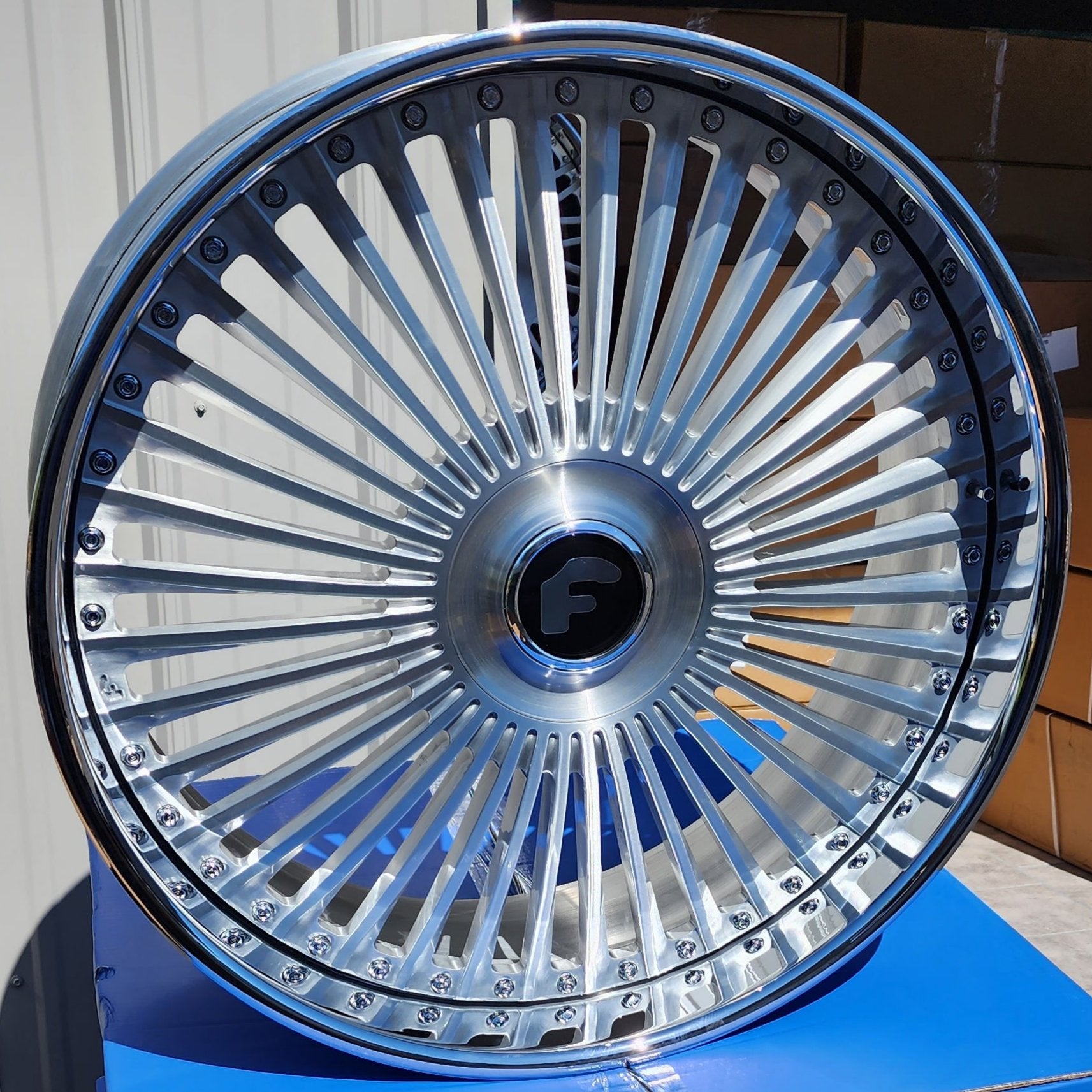 A single green leaf against a white background.
