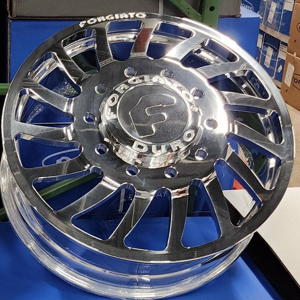 A single green leaf against a white background.