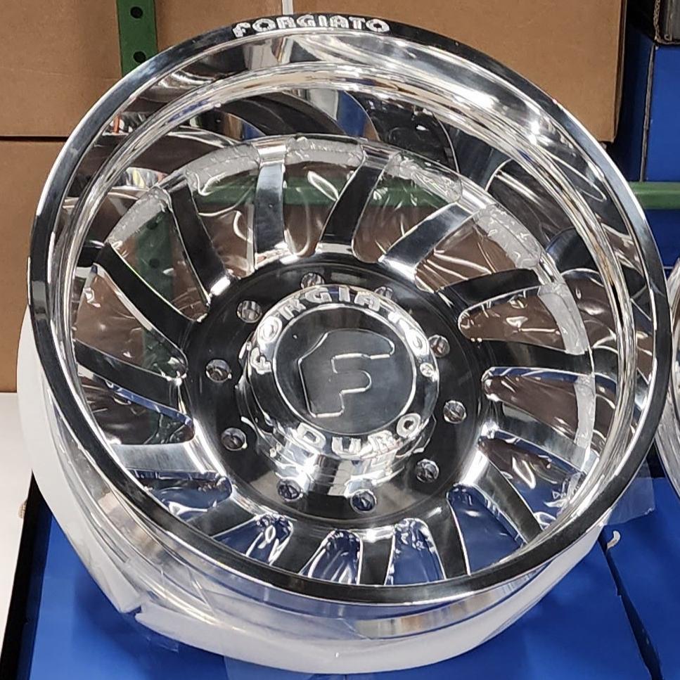 A single green leaf against a white background.