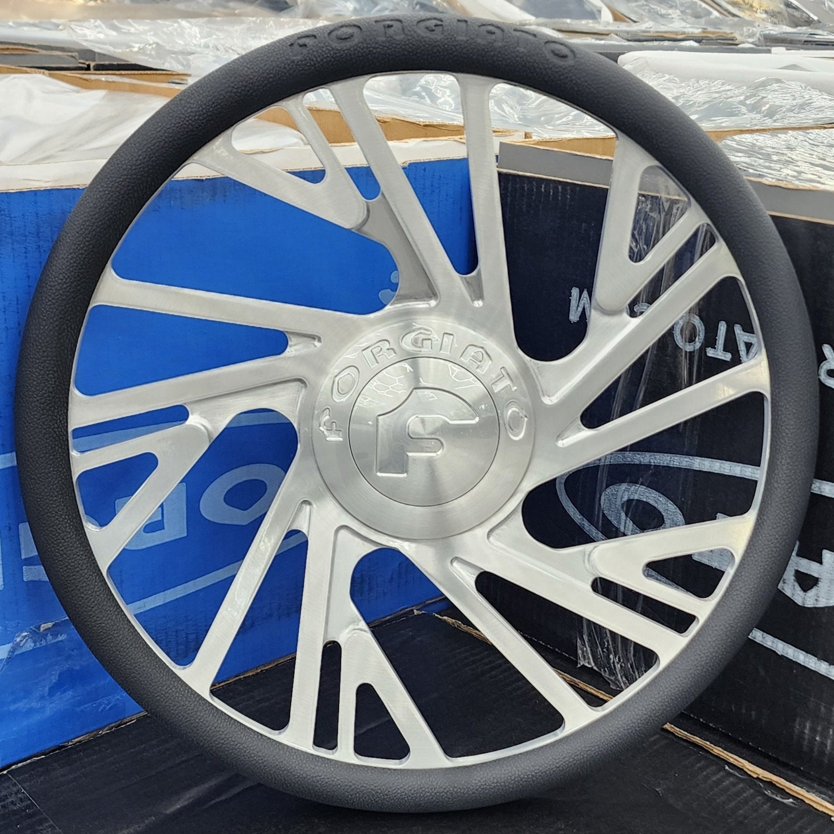A single green leaf against a white background.