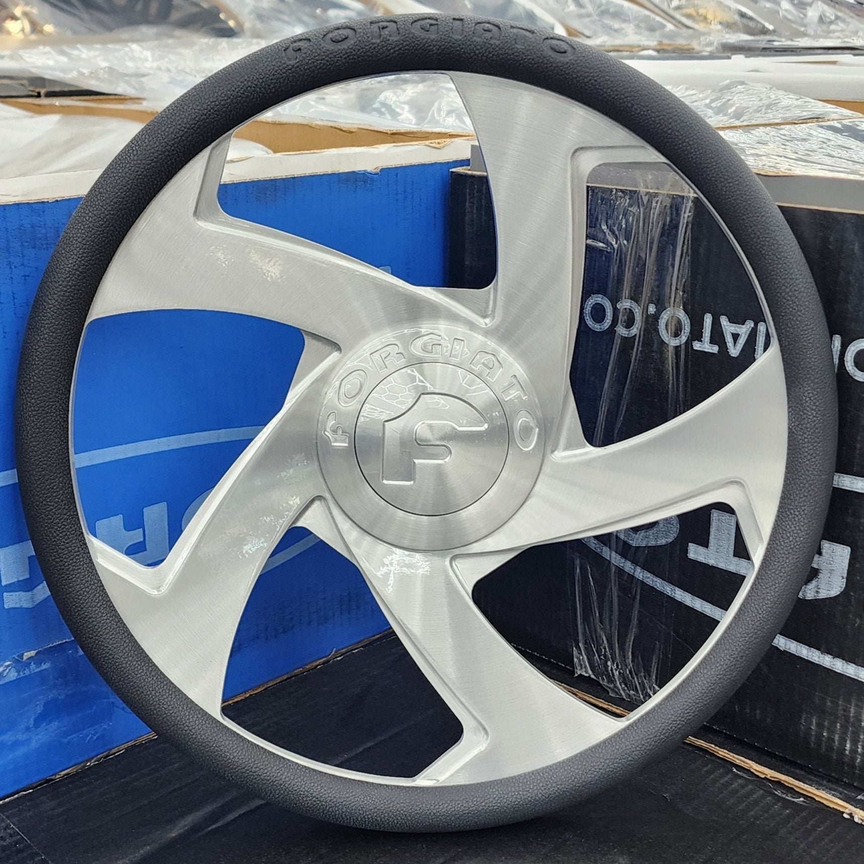 A single green leaf against a white background.