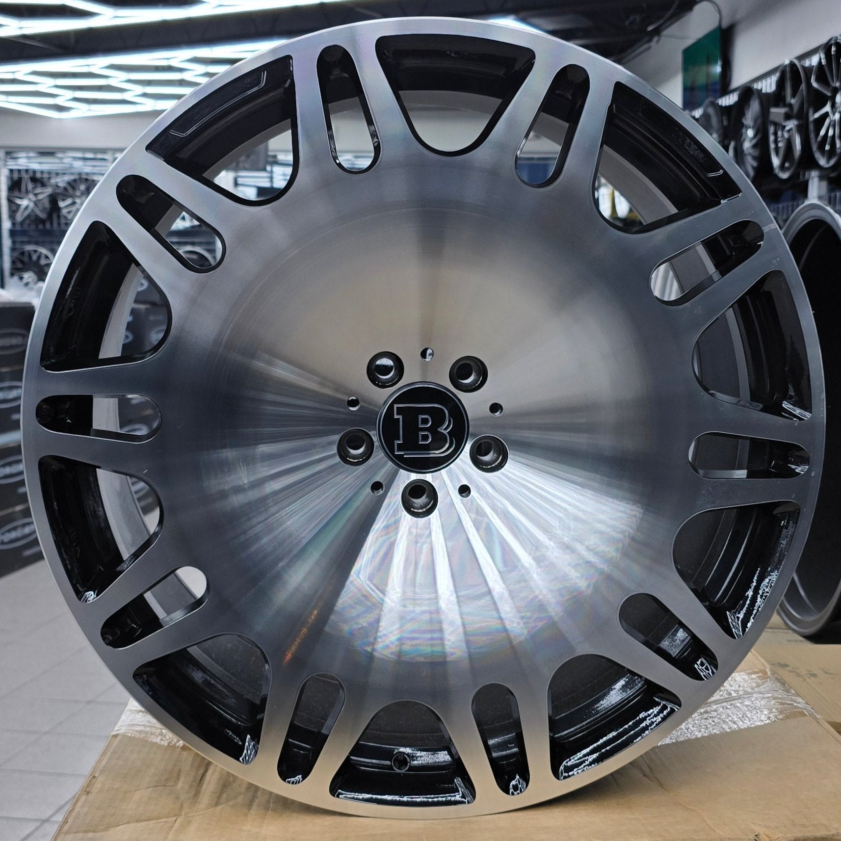 A single green leaf against a white background.