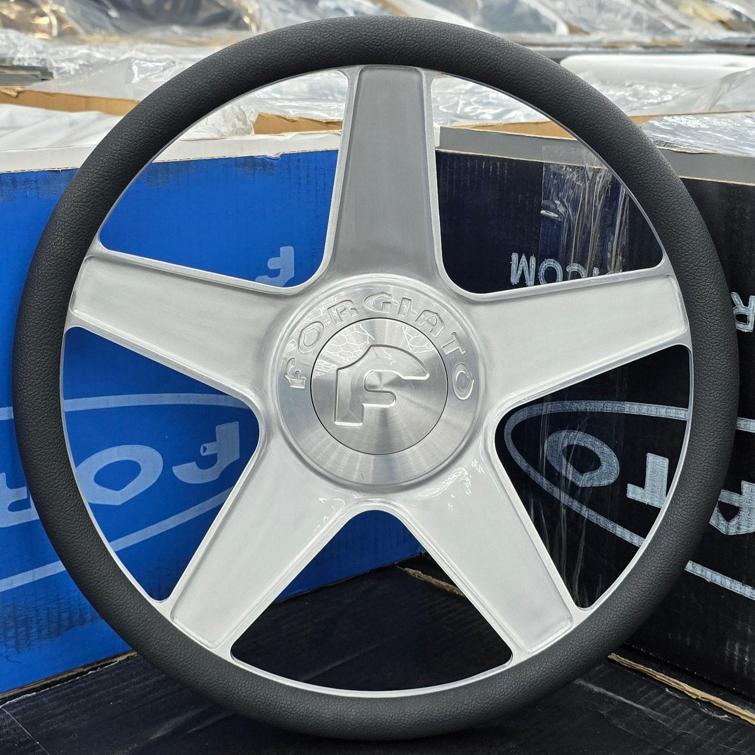 A single green leaf against a white background.