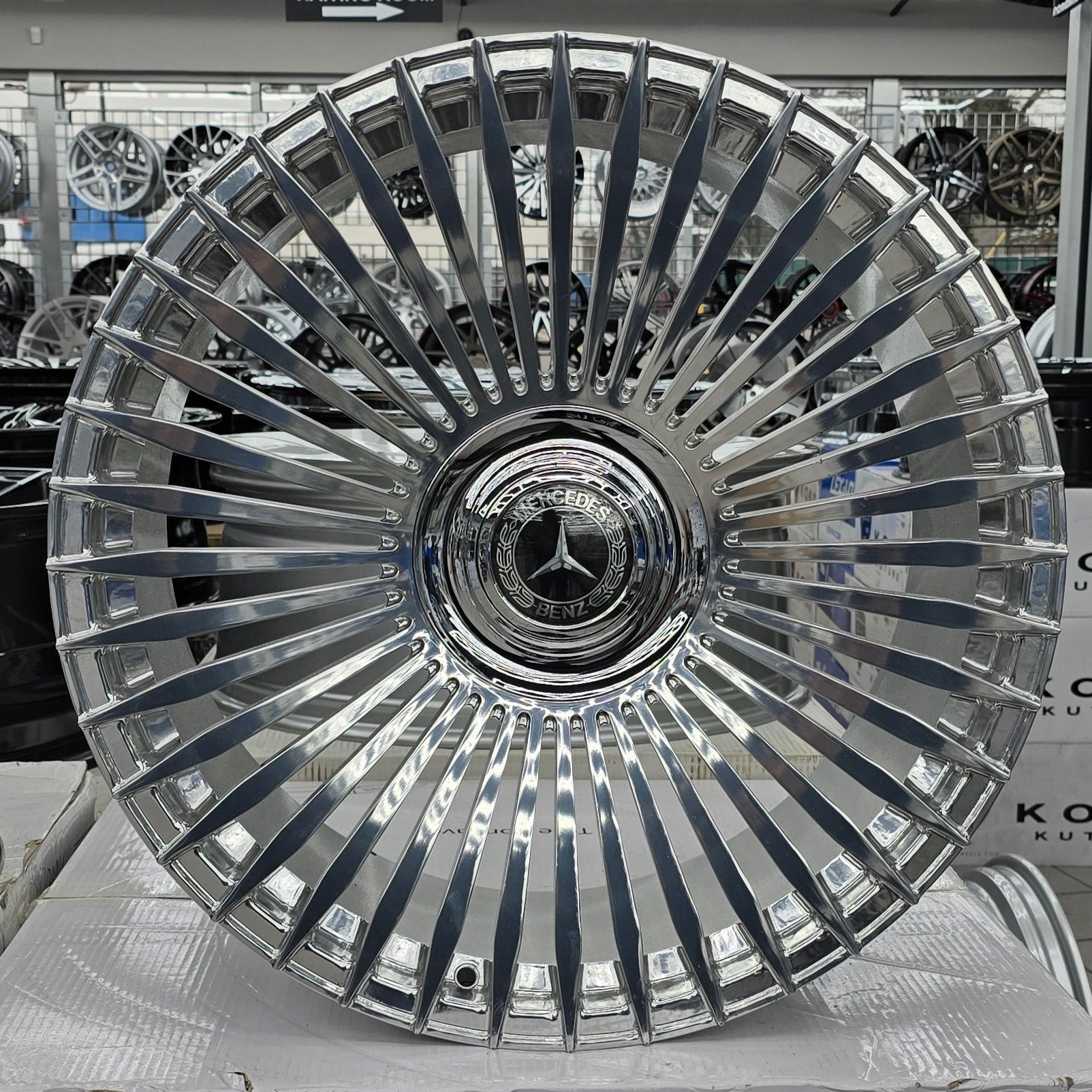 A single green leaf against a white background.