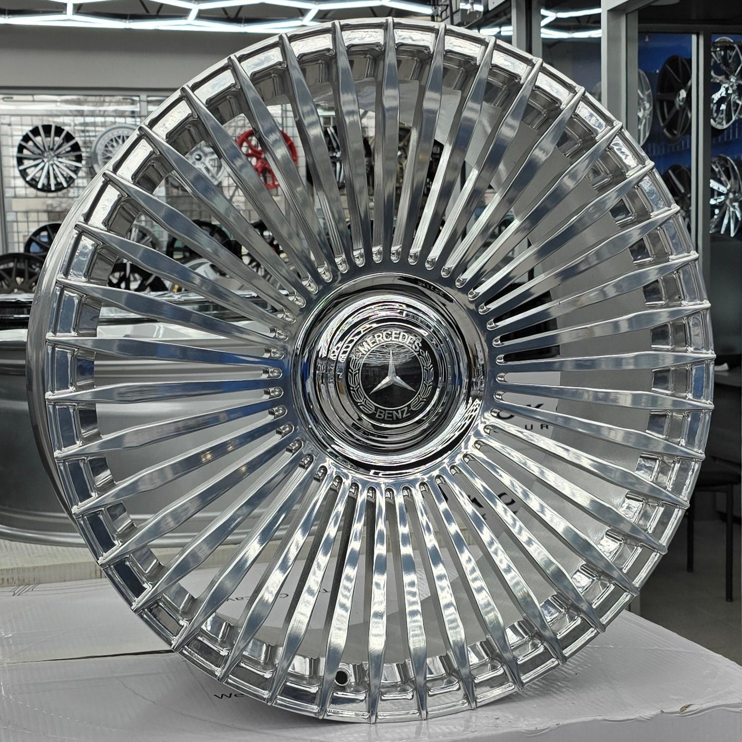 A single green leaf against a white background.