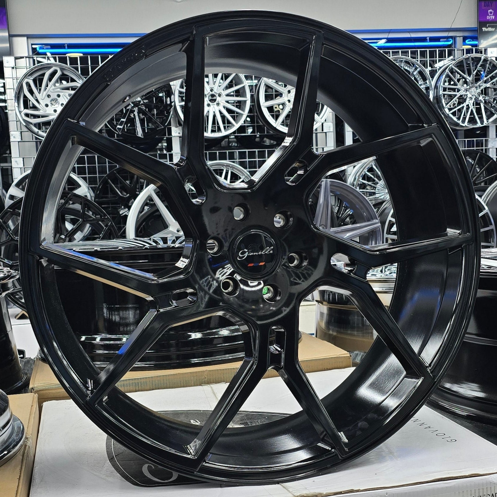 A single green leaf against a white background.