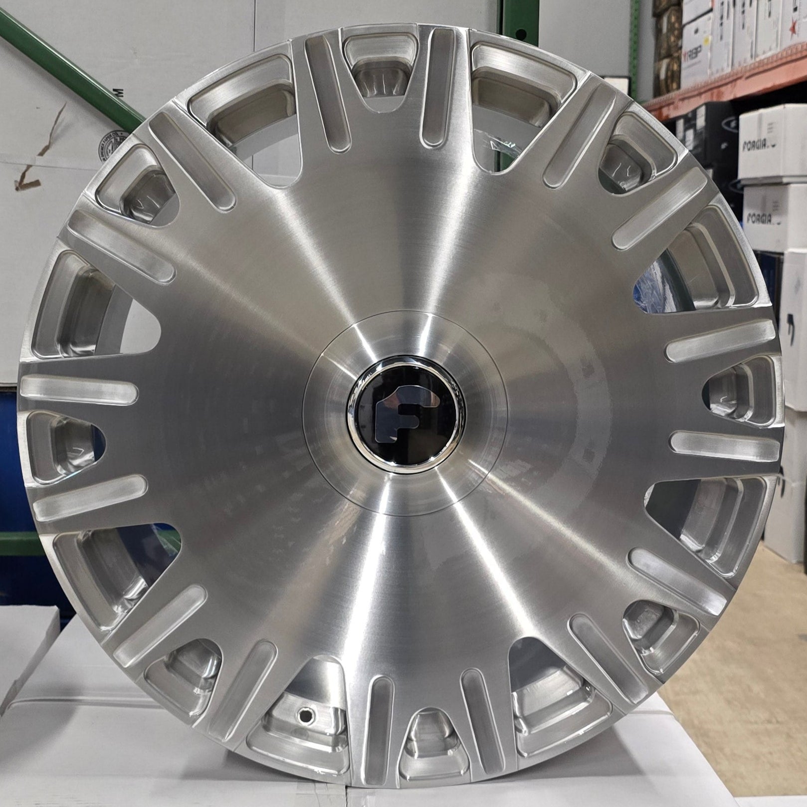 A single green leaf against a white background.