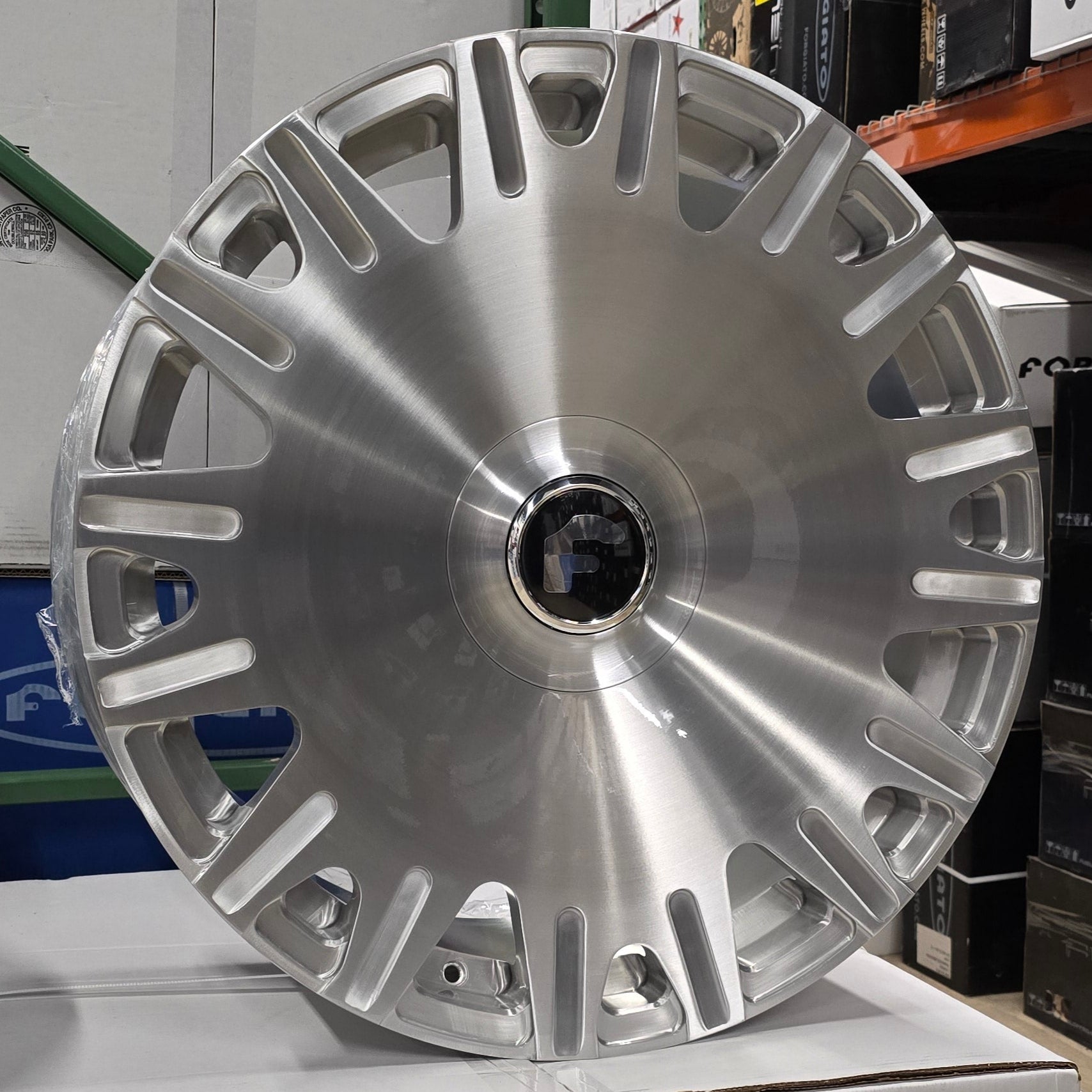 A single green leaf against a white background.