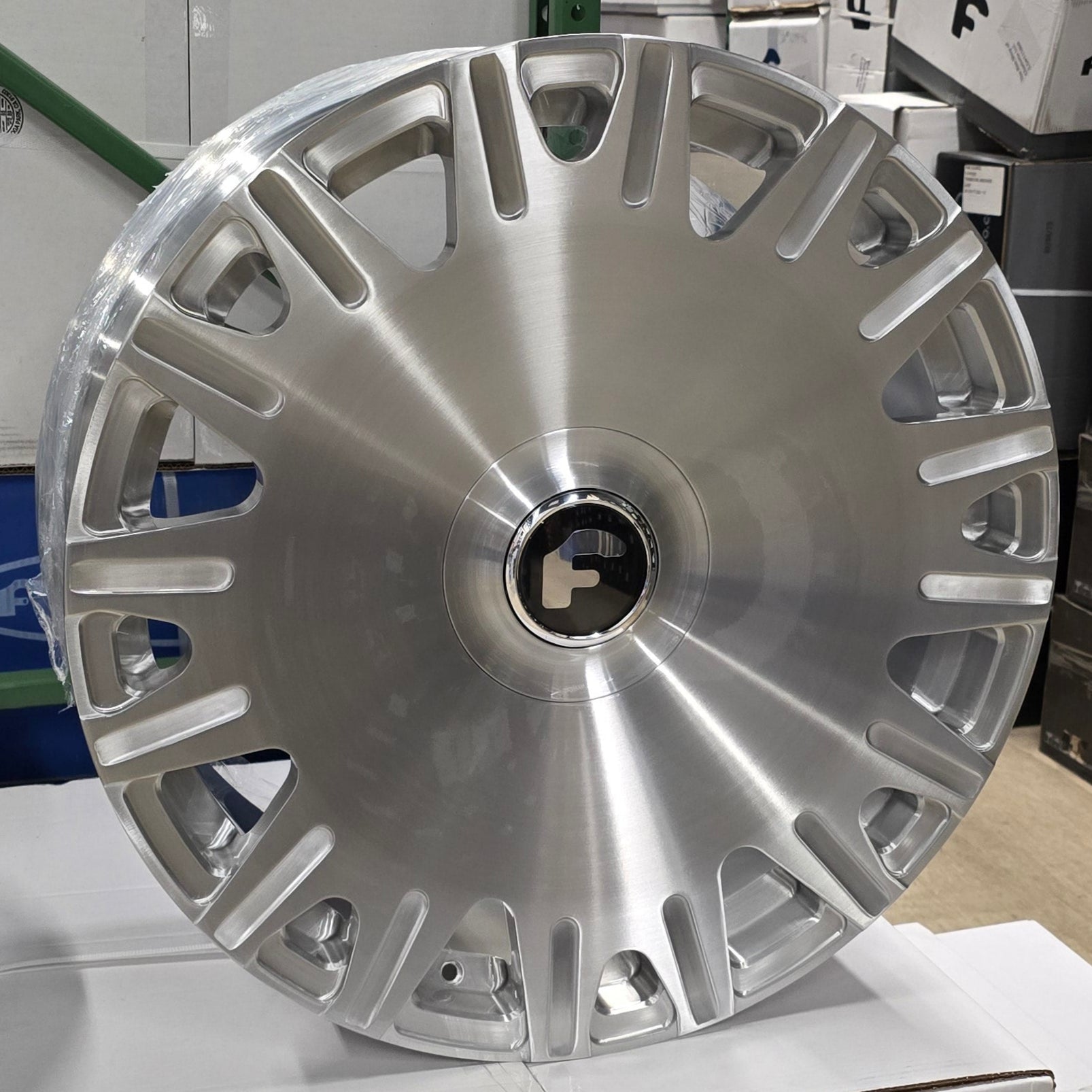 A single green leaf against a white background.