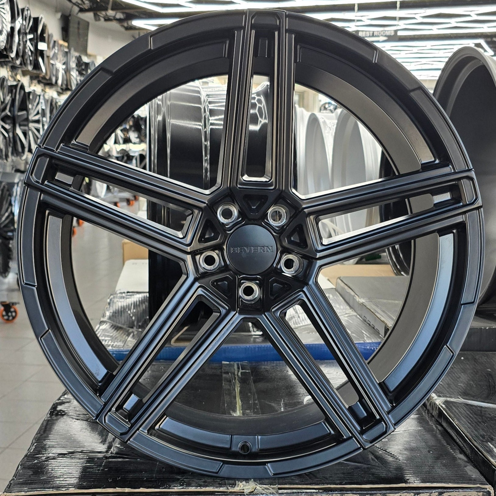 A single green leaf against a white background.