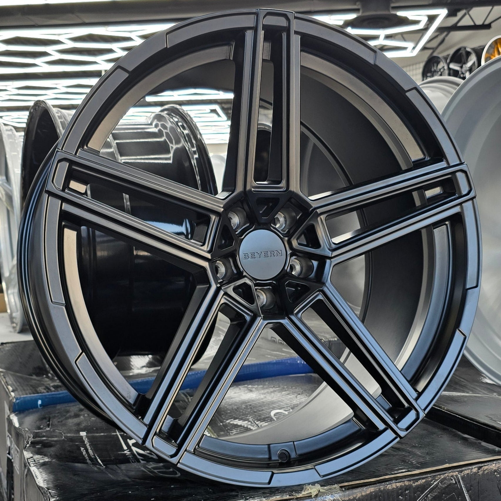 A single green leaf against a white background.