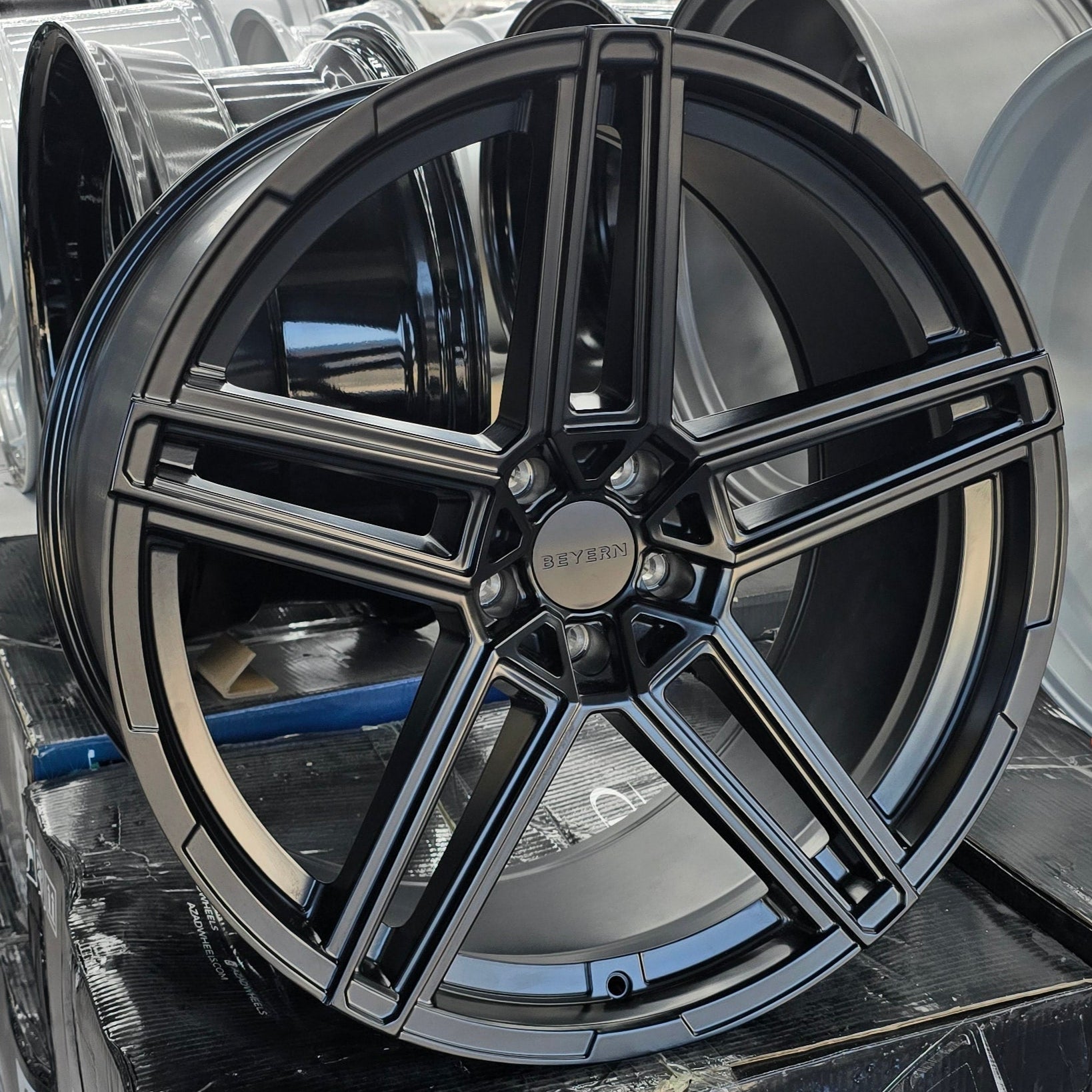 A single green leaf against a white background.