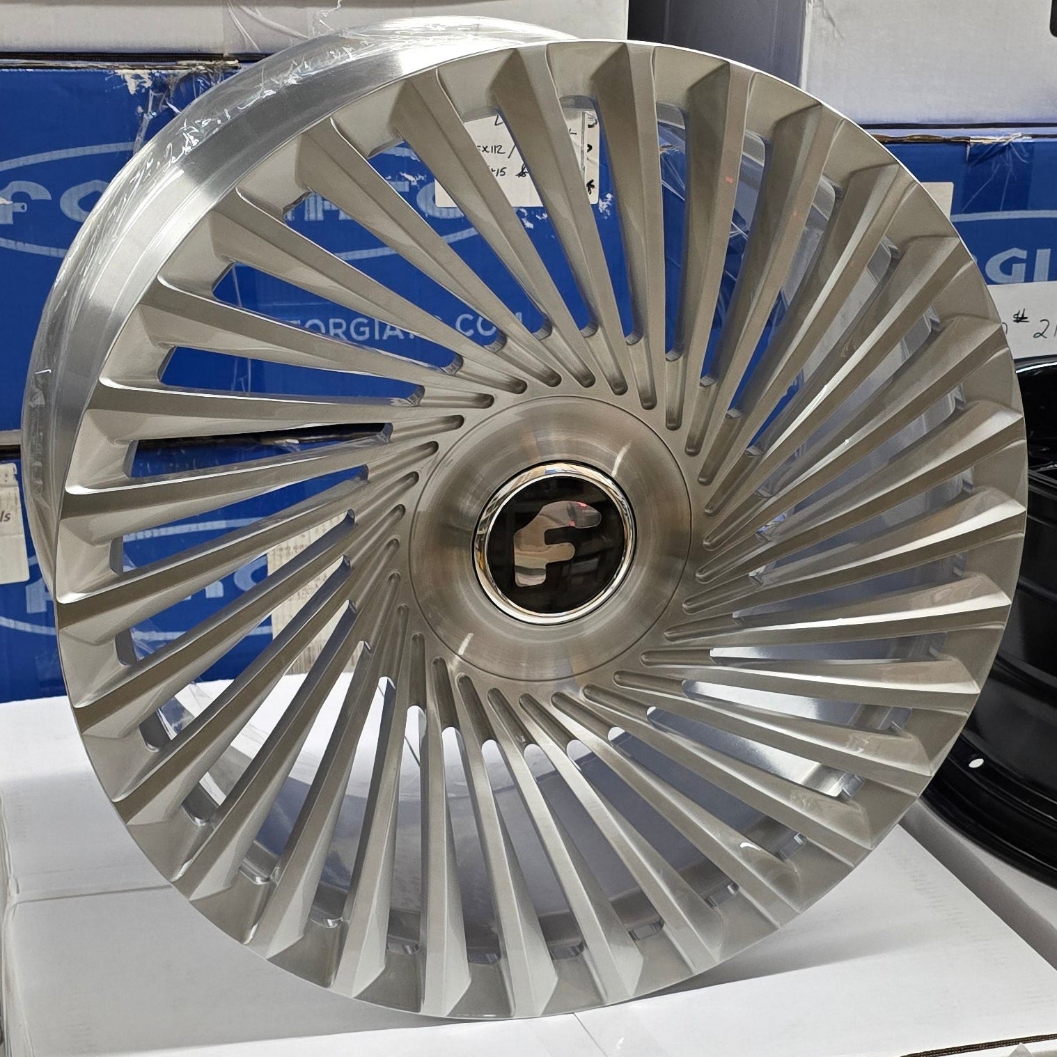 A single green leaf against a white background.