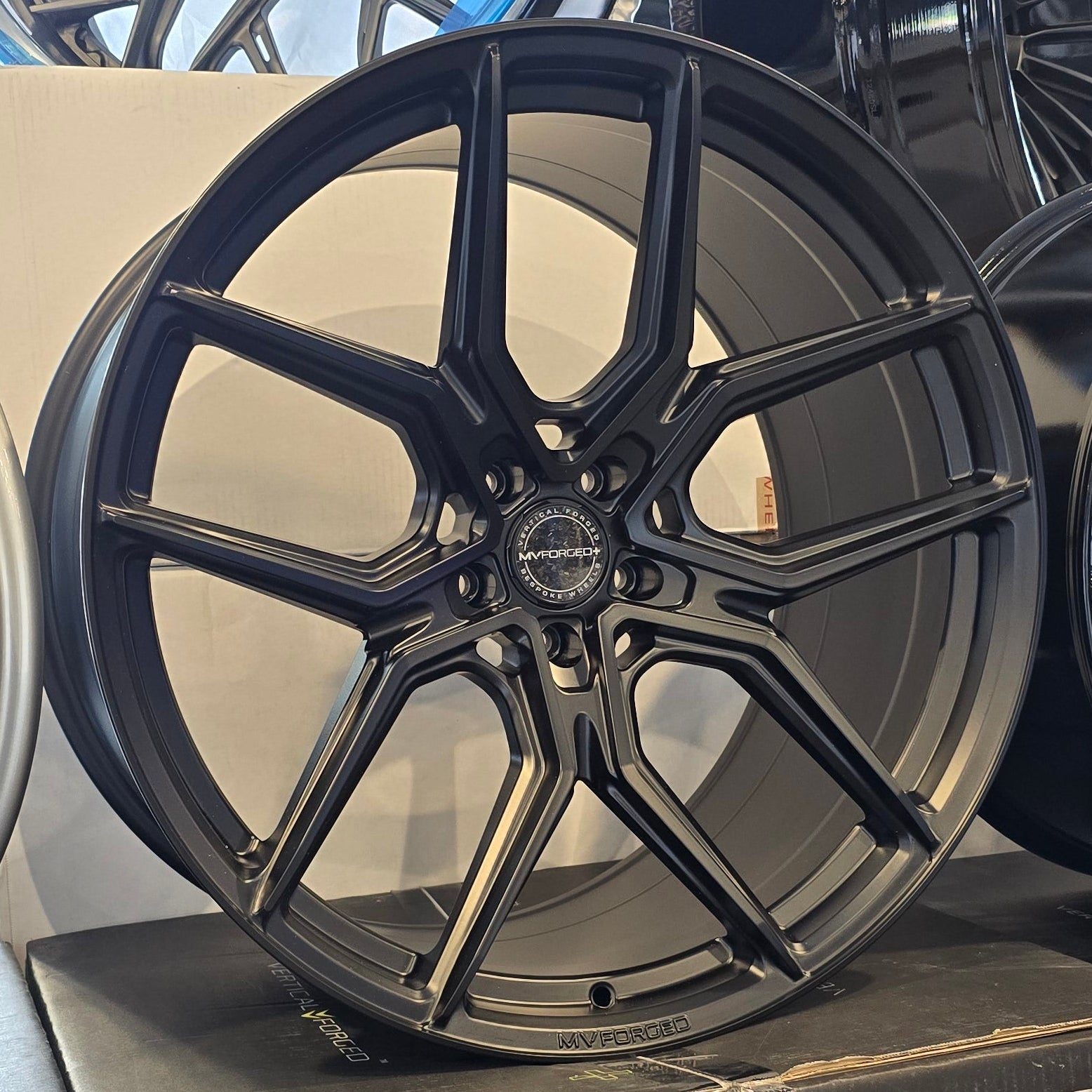 A single green leaf against a white background.