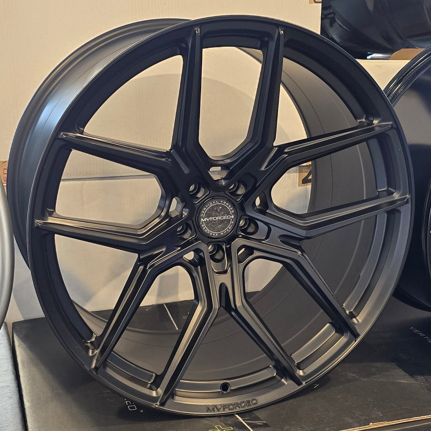 A single green leaf against a white background.