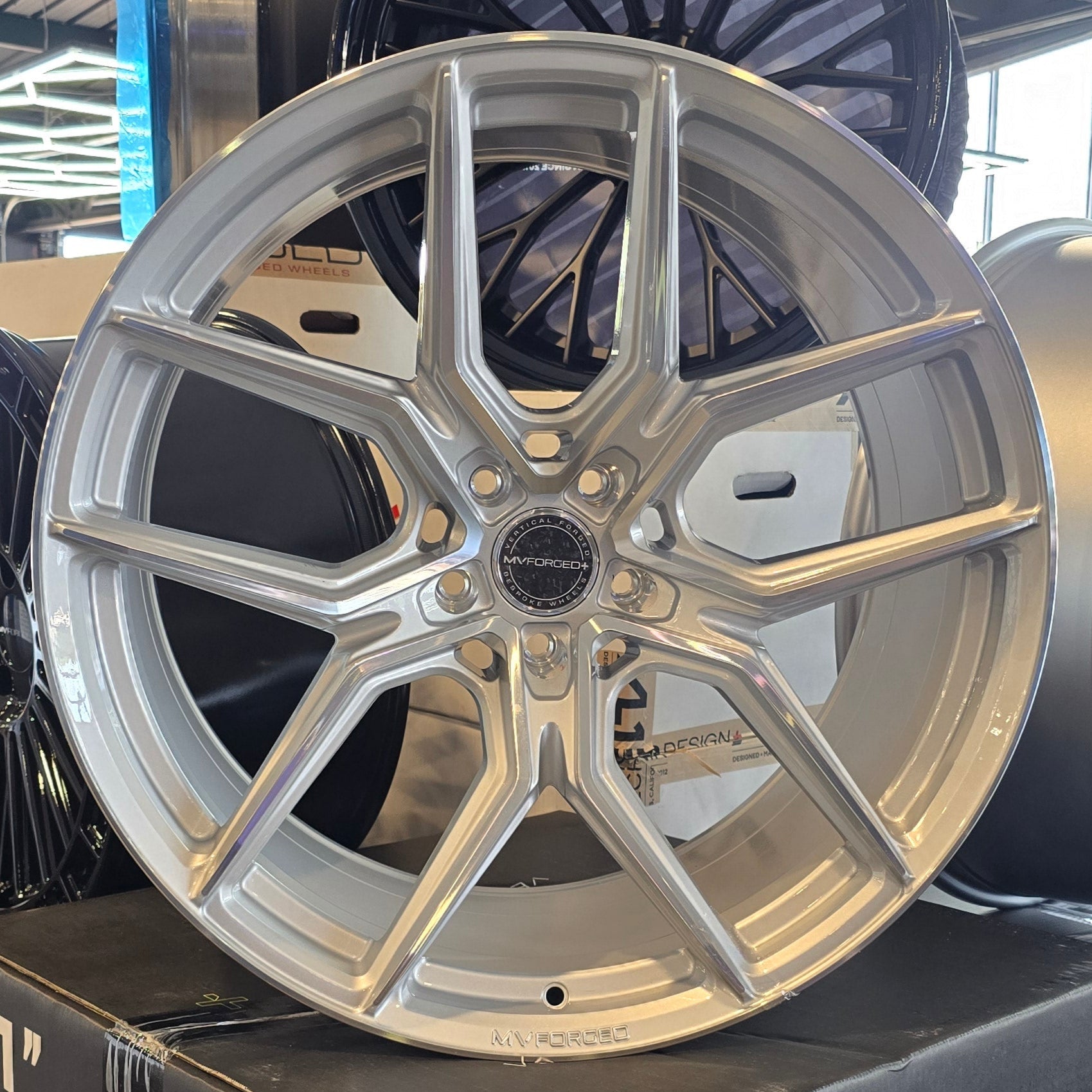 A single green leaf against a white background.