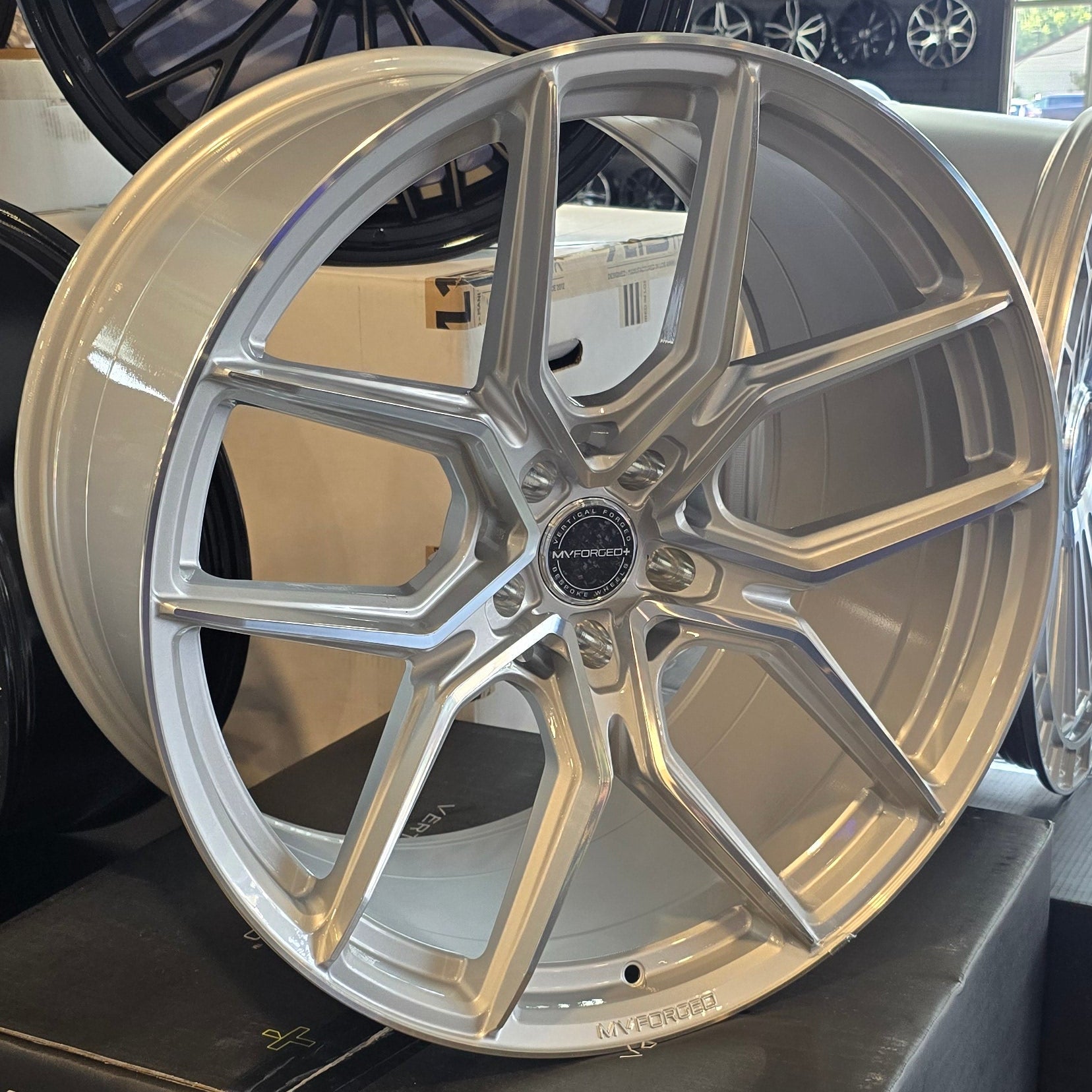 A single green leaf against a white background.