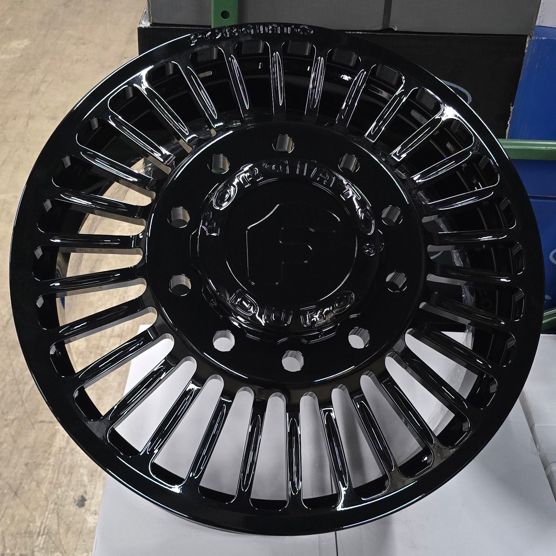 A single green leaf against a white background.