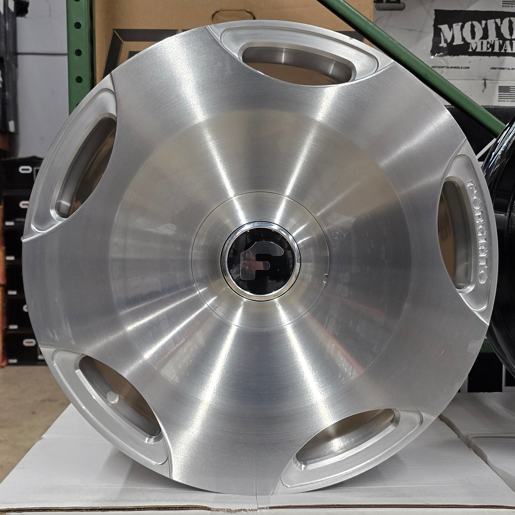 A single green leaf against a white background.