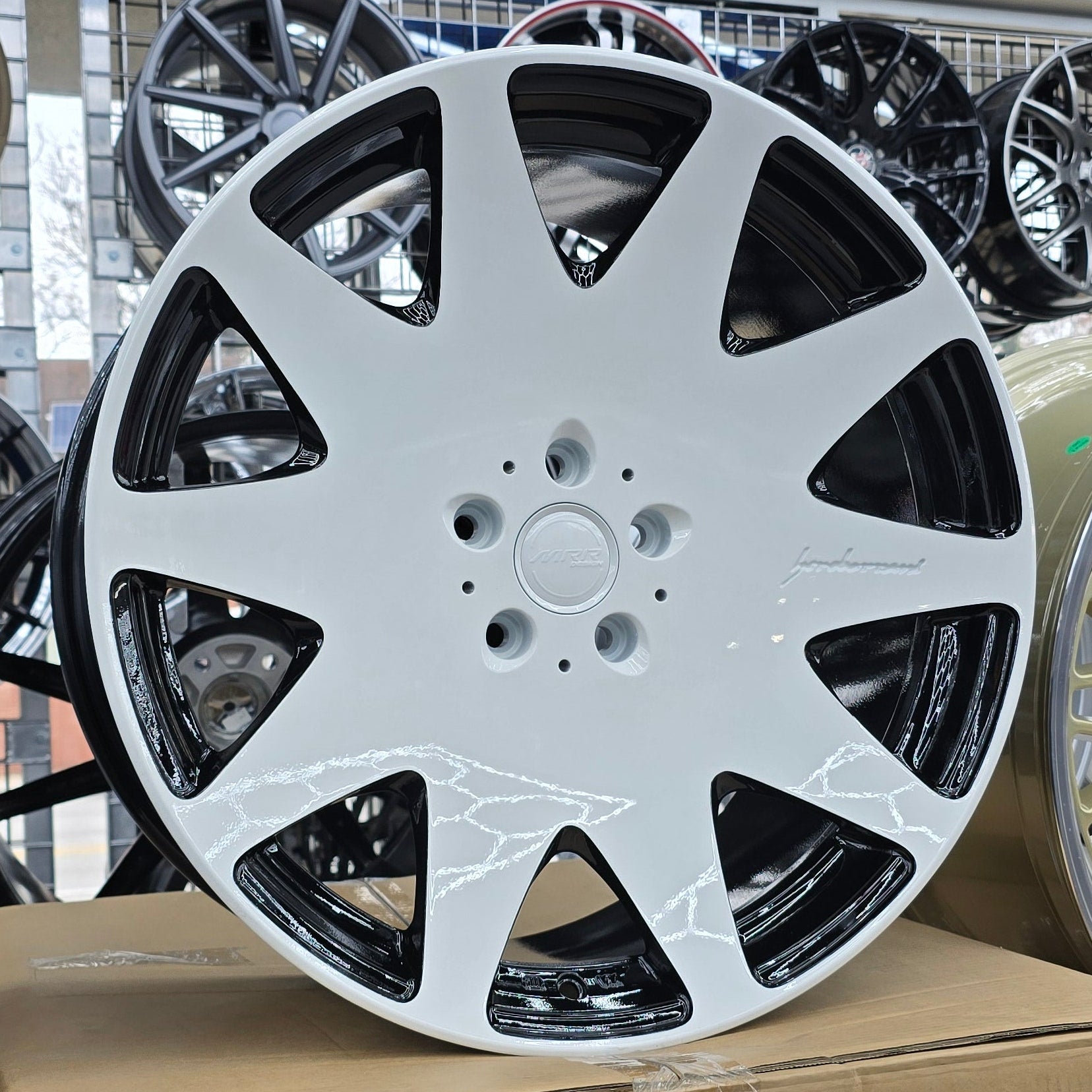 A single green leaf against a white background.