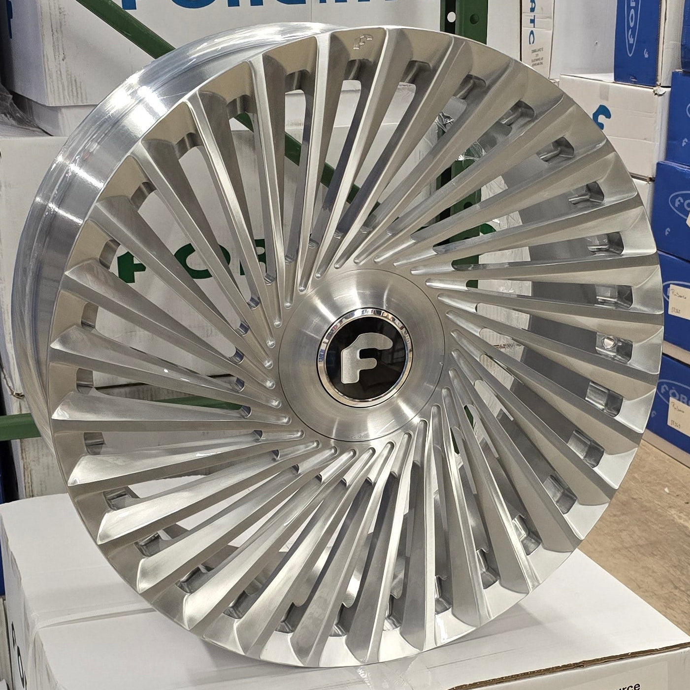 A single green leaf against a white background.