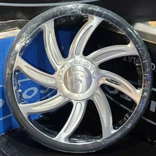 A single green leaf against a white background.