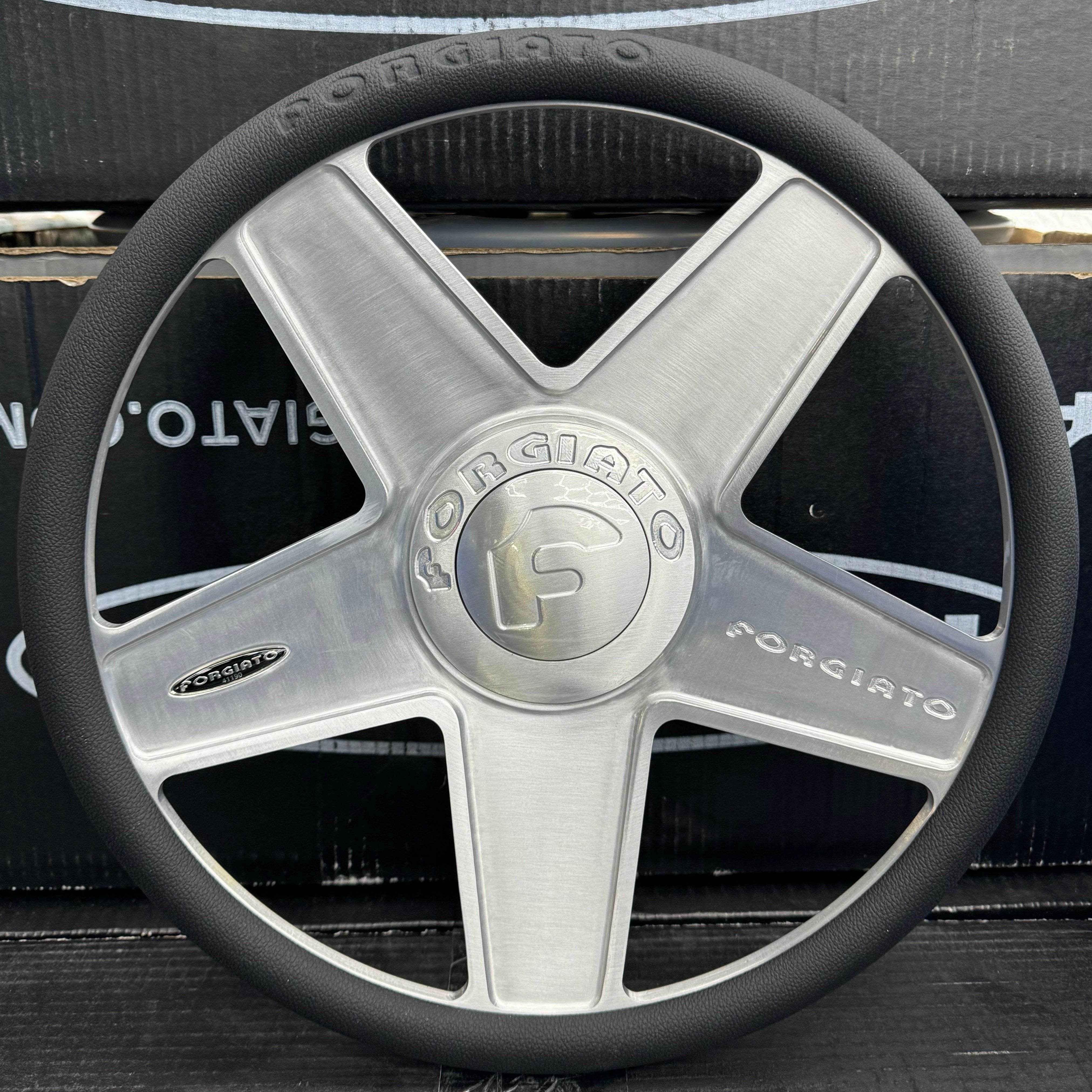 A single green leaf against a white background.