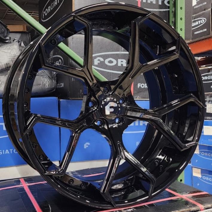 A single green leaf against a white background.