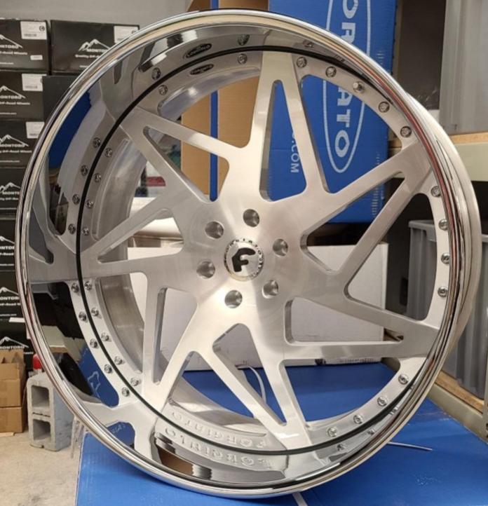 A single green leaf against a white background.