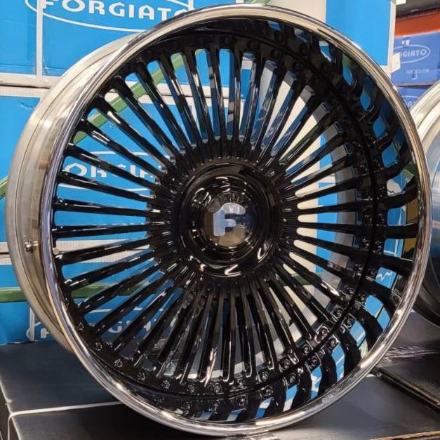 A single green leaf against a white background.