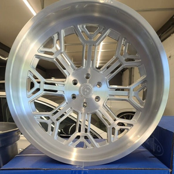 A single green leaf against a white background.