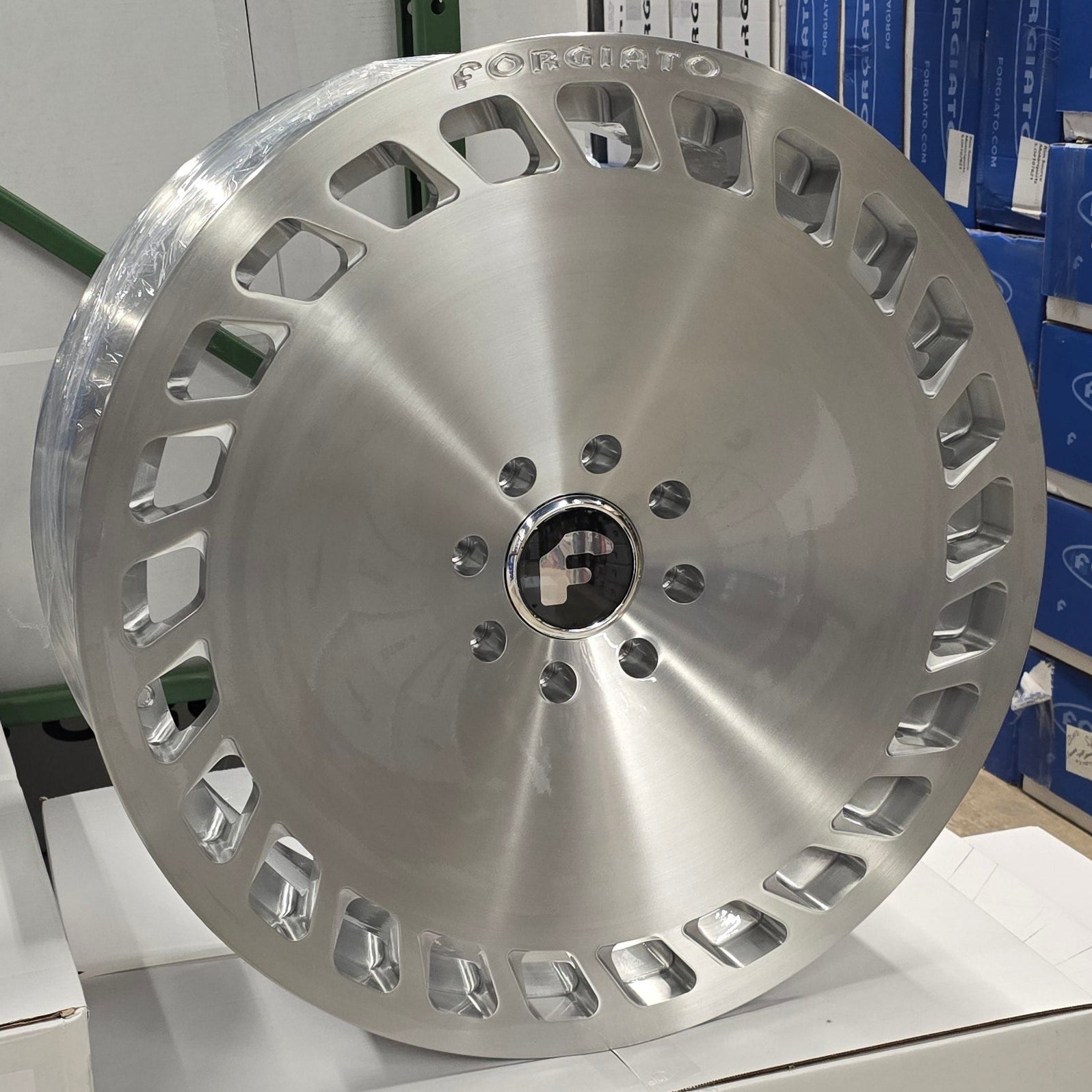 A single green leaf against a white background.